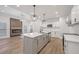 Bright, modern kitchen with white cabinets, stainless steel appliances, and a stylish island at 3850 Laurel Nw Dr, Acworth, GA 30101