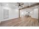 Spacious living room featuring beamed ceilings and an open view of the modern kitchen at 3850 Laurel Nw Dr, Acworth, GA 30101