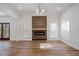 Modern living room with wood floors, a stylish fireplace feature, and bright windows at 3850 Laurel Nw Dr, Acworth, GA 30101