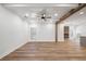 Bright living room featuring beamed ceilings and an open view of the fireplace at 3850 Laurel Nw Dr, Acworth, GA 30101