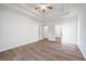 Spacious bedroom featuring tray ceilings and hardwood floors at 3850 Laurel Nw Dr, Acworth, GA 30101