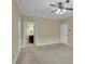 Bedroom features neutral walls, plush carpet, and a ceiling fan light fixture at 509 Sawnee Corners Dr, Cumming, GA 30040