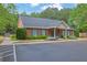 Attractive brick clubhouse with well-maintained landscaping and ample parking for community gatherings at 509 Sawnee Corners Dr, Cumming, GA 30040
