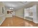 Dining area featuring hardwood floors, natural light, and adjacent kitchen at 509 Sawnee Corners Dr, Cumming, GA 30040