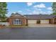 Brick home with an attached two-car garage and driveway at 509 Sawnee Corners Dr, Cumming, GA 30040
