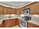 Updated kitchen boasting stainless steel appliances and ample counter space at 509 Sawnee Corners Dr, Cumming, GA 30040