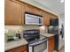 Modern kitchen showcasing stainless steel appliances and stylish countertops at 509 Sawnee Corners Dr, Cumming, GA 30040