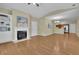 Spacious living room with hardwood floors, fireplace, and open layout to the kitchen at 509 Sawnee Corners Dr, Cumming, GA 30040