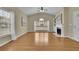 Bright living room boasting hardwood floors, a fireplace, and large windows at 509 Sawnee Corners Dr, Cumming, GA 30040