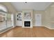 Inviting living room showcasing hardwood floors, fireplace, and large windows at 509 Sawnee Corners Dr, Cumming, GA 30040
