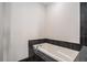 Modern bathroom with black granite tile surround on white bathtub at 1080 Peachtree Ne St # 2515, Atlanta, GA 30309