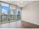 Bedroom featuring hardwood floors and floor-to-ceiling windows with expansive city views at 1080 Peachtree Ne St # 2515, Atlanta, GA 30309