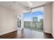 Bedroom with wood flooring and amazing city view through sliding glass doors at 1080 Peachtree Ne St # 2515, Atlanta, GA 30309