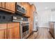 Modern kitchen with stainless steel appliances and wooden cabinetry at 1080 Peachtree Ne St # 2515, Atlanta, GA 30309