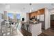 Contemporary kitchen and dining area with modern island, stainless appliances, and skyline views at 1080 Peachtree Ne St # 2515, Atlanta, GA 30309