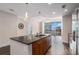 Modern kitchen island with granite countertop, stainless steel appliances, and wood flooring at 1080 Peachtree Ne St # 2515, Atlanta, GA 30309