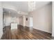 An open concept living space with a kitchen island and hard wood floors at 1080 Peachtree Ne St # 2515, Atlanta, GA 30309