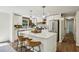 Open kitchen with a large island, stainless steel appliances, and hardwood floors at 125 Roswell Farms Ln, Roswell, GA 30075