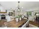 Open floor plan showing the dining room, kitchen, and living room, complete with hardwood floors at 125 Roswell Farms Ln, Roswell, GA 30075