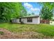 Spacious backyard surrounded by mature trees and greenery offers plenty of space to enjoy! at 2804 Hall Se Dr, Smyrna, GA 30082