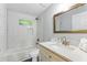 Bathroom features a shower-over-tub, a stylish vanity, and white subway tile; bright and clean at 2804 Hall Se Dr, Smyrna, GA 30082