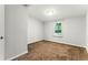 Cozy bedroom featuring neutral carpet and natural light from a window at 2804 Hall Se Dr, Smyrna, GA 30082