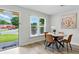 Eat-in dining area boasting wood floors, a dining table, and a view to the front yard at 2804 Hall Se Dr, Smyrna, GA 30082