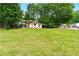 View of a home with a green front door and a long driveway at 2804 Hall Se Dr, Smyrna, GA 30082