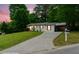 Well-kept home on a sloping lot, featuring a long driveway and carport at 2804 Hall Se Dr, Smyrna, GA 30082