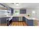 Bright kitchen featuring stainless steel appliances, white countertops, and tiled backsplash at 2804 Hall Se Dr, Smyrna, GA 30082