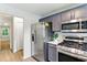 Modern kitchen with stainless steel appliances, view into another room, and sleek design at 2804 Hall Se Dr, Smyrna, GA 30082