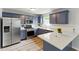 Updated kitchen with stainless steel appliances, white countertops, and contemporary blue cabinets at 2804 Hall Se Dr, Smyrna, GA 30082
