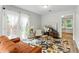 Living room with neutral tones, stylish furnishings, and access to outdoor at 2804 Hall Se Dr, Smyrna, GA 30082