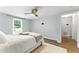 Spacious main bedroom with a comfortable bed, ceiling fan, and ample natural light at 2804 Hall Se Dr, Smyrna, GA 30082