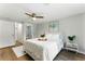 Comfortable main bedroom with a cozy bed, ceiling fan, and soft lighting; stylish and inviting at 2804 Hall Se Dr, Smyrna, GA 30082