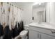 Bathroom featuring a white vanity with countertop, framed mirror, and shower with curtain at 813 Ambient Sw Way, Atlanta, GA 30331