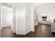 Hallway view leading to a powder room on the left and the living room in the background at 813 Ambient Sw Way, Atlanta, GA 30331