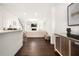 Open floor plan with hardwood floors, modern lighting, and great natural light at 813 Ambient Sw Way, Atlanta, GA 30331