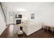 Cozy living room featuring fireplace, hardwood floors, and contemporary furnishings at 813 Ambient Sw Way, Atlanta, GA 30331