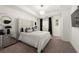 Luxurious main bedroom with tufted headboard, tray ceiling, and modern chandelier at 813 Ambient Sw Way, Atlanta, GA 30331