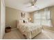 Cozy bedroom with a ceiling fan, plush carpet, and soft natural light at 891 Berryman Pl, Lawrenceville, GA 30045