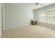 Light-filled bedroom with neutral walls, a ceiling fan, and large windows at 891 Berryman Pl, Lawrenceville, GA 30045