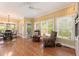Bright breakfast nook with hardwood floors, lots of windows and natural light and view to the kitchen at 891 Berryman Pl, Lawrenceville, GA 30045