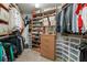 Walk-in closet with custom shelves and storage for clothes, shoes, and accessories at 891 Berryman Pl, Lawrenceville, GA 30045