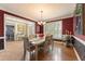 Beautifully appointed dining room with a wooden table, decorative accents, and stylish lighting at 891 Berryman Pl, Lawrenceville, GA 30045