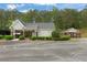 Community entrance with gated access and well-maintained landscaping at 891 Berryman Pl, Lawrenceville, GA 30045