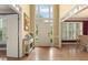 Inviting foyer with hardwood floors, soaring ceilings, and a view into the adjacent dining and living spaces at 891 Berryman Pl, Lawrenceville, GA 30045