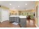 Bright kitchen with stainless appliances, center island, quartz countertops, and a breakfast nook with natural light at 891 Berryman Pl, Lawrenceville, GA 30045