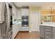 Modern kitchen featuring stainless steel appliances, white cabinets, subway tile backsplash, and updated fixtures at 891 Berryman Pl, Lawrenceville, GA 30045