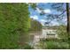 Scenic lake view with a private dock and lush green surroundings at 891 Berryman Pl, Lawrenceville, GA 30045